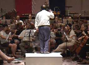 Conductor Jules van Hessen working hard to keep the jet-legged orchestra awake