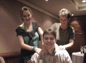 Overworked photographer Martin Lohmeier receives a well-earned massage from the charming Saskia Luijendijk and Hilde Denissen.