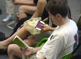 Jos Mutter killing time by reading a comic.